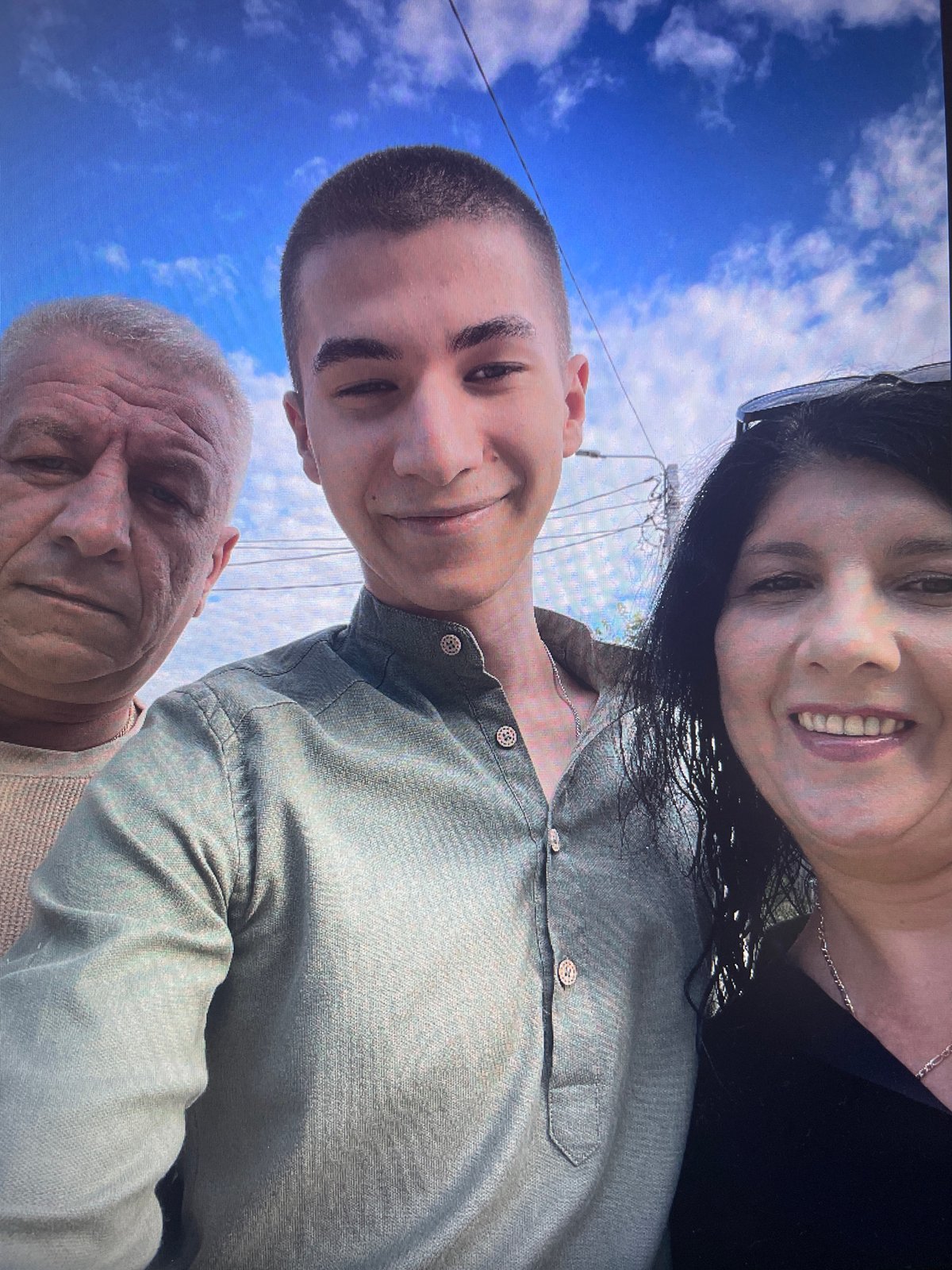 Three people pose for outdoor selfie in Iași