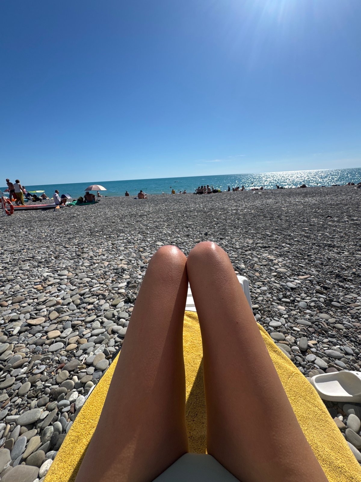 Lazy summer afternoon on Sochi's Black Sea pebble beach