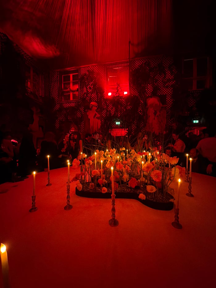 DJ event unfolds under red lights at Paris bar