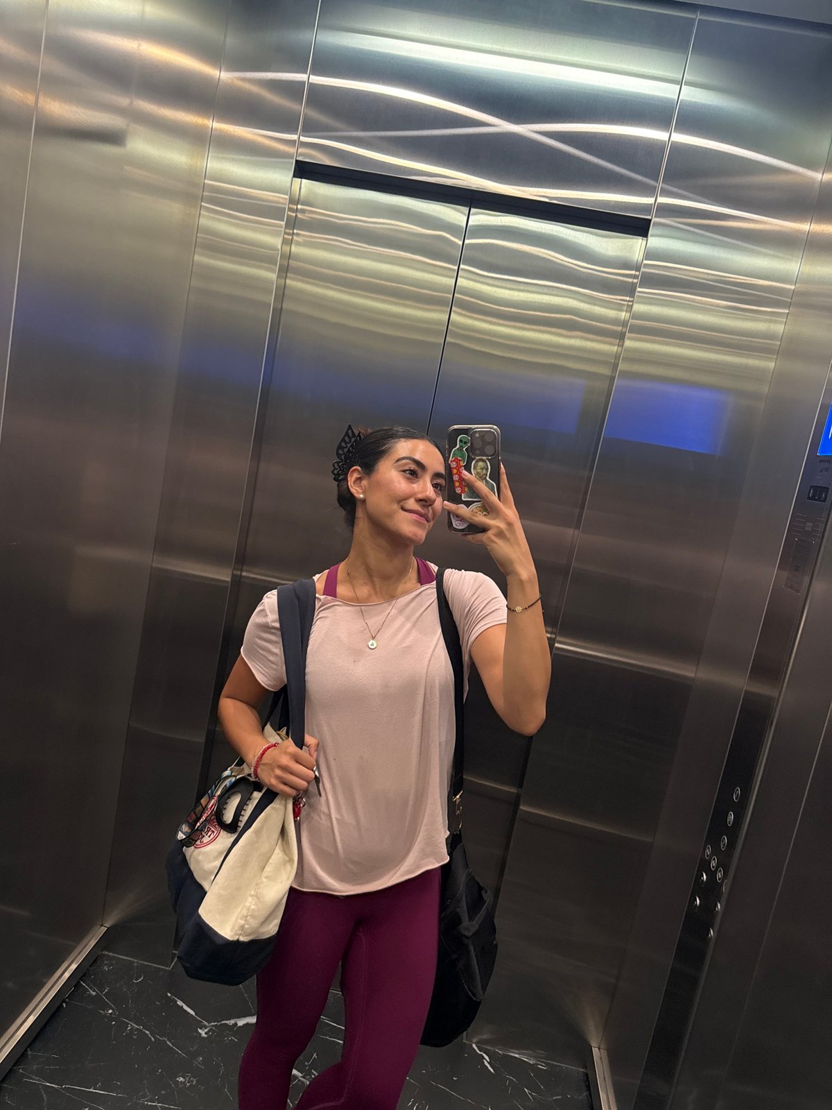 Woman takes elevator selfie in Puebla, Mexico
