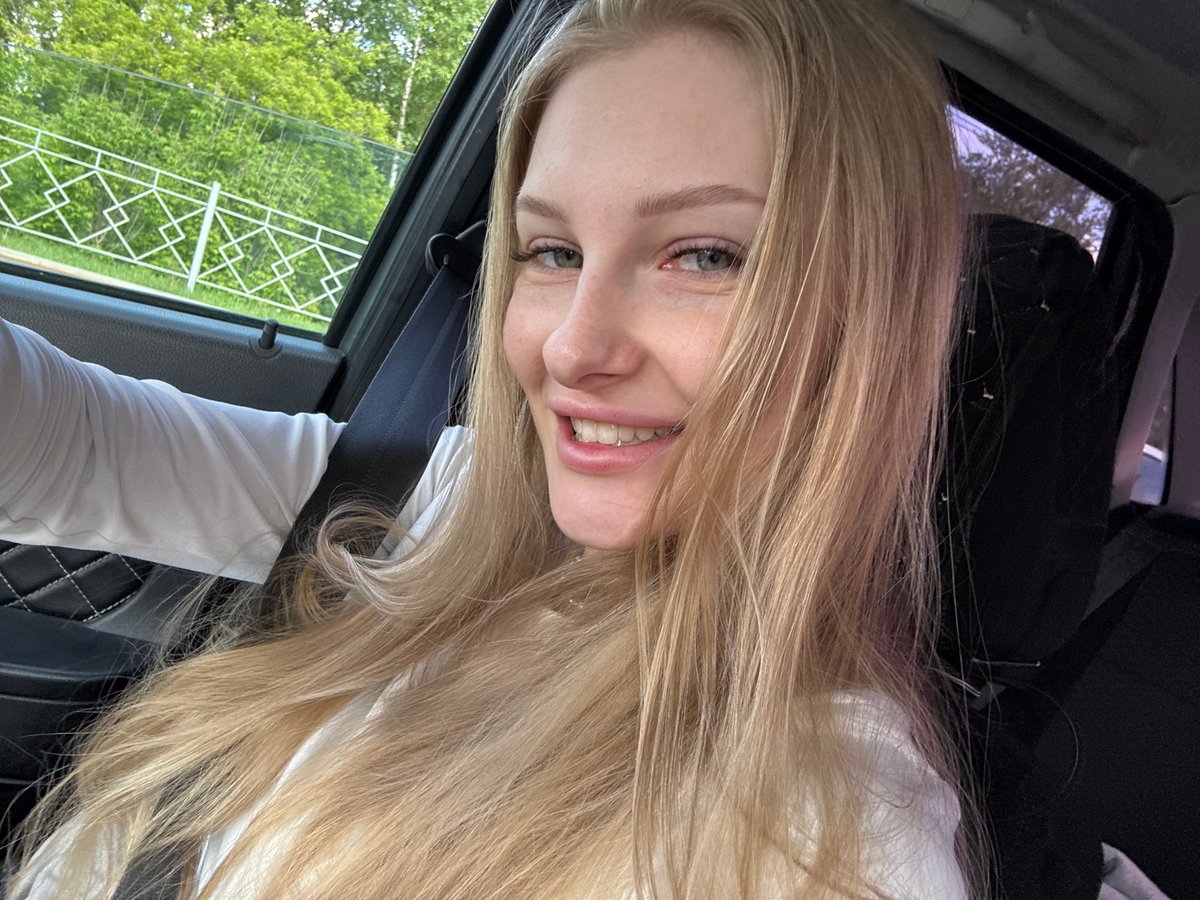 Woman takes playful selfies in car in Perm, Russia