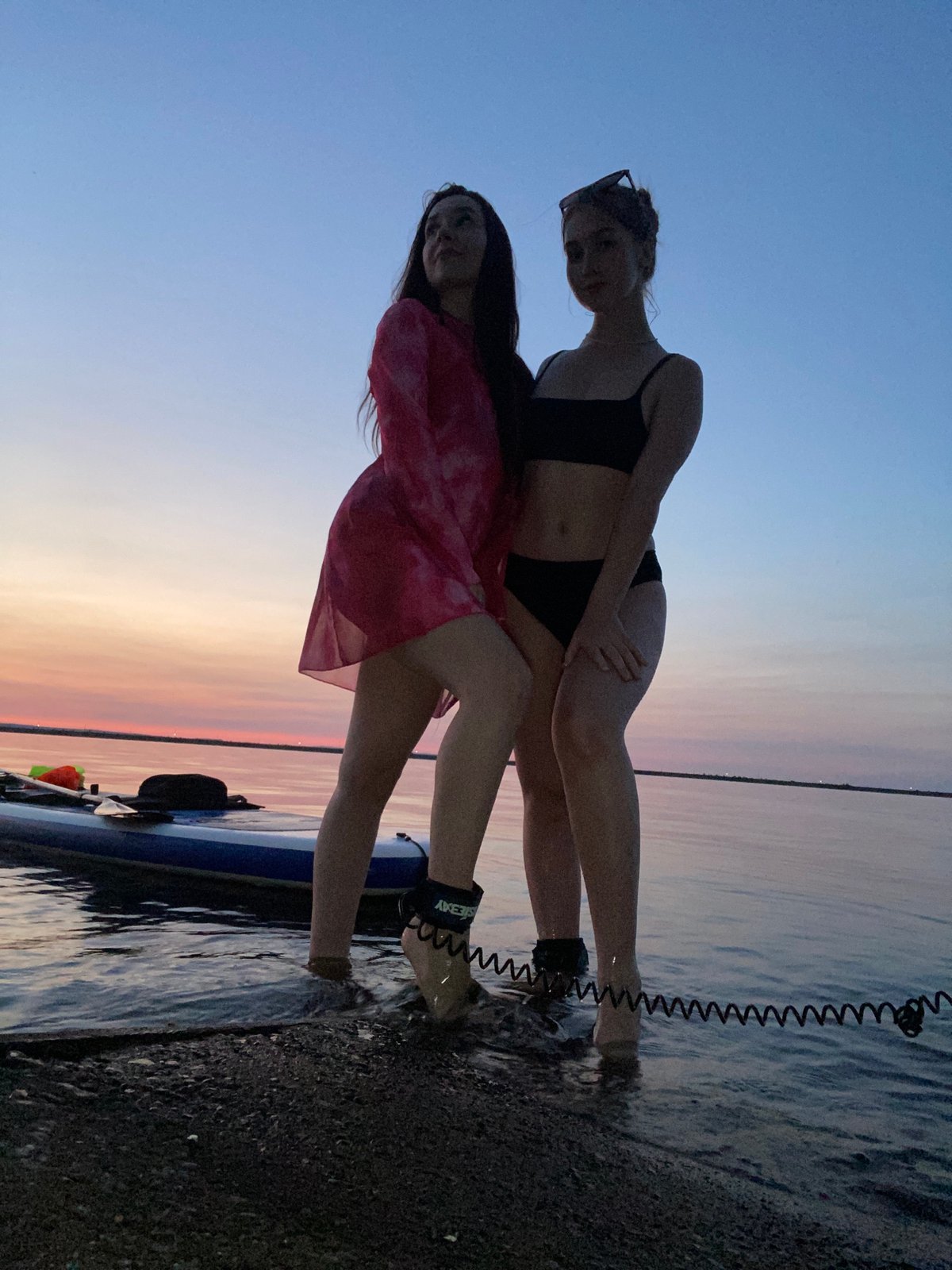 Sunset paddleboarding on calm water in Chaikovsky, Russia