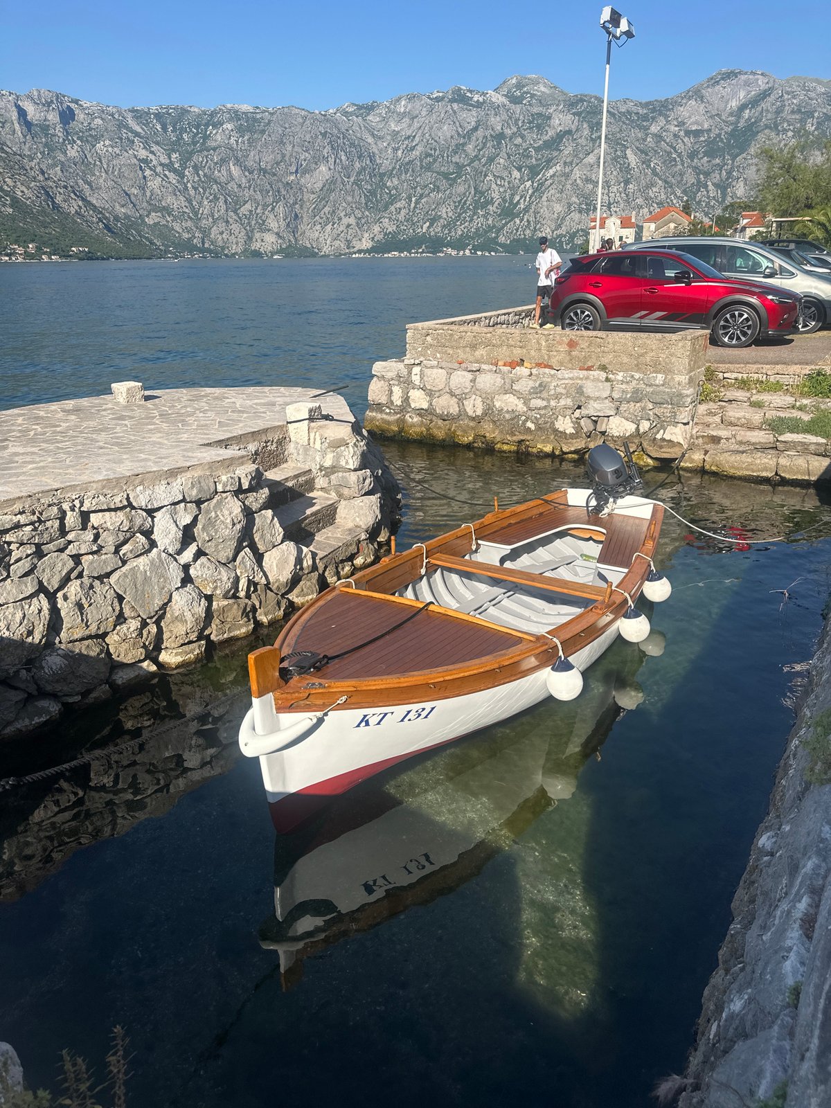 Clear afternoon captures Bay of Kotor's historic waterfront life