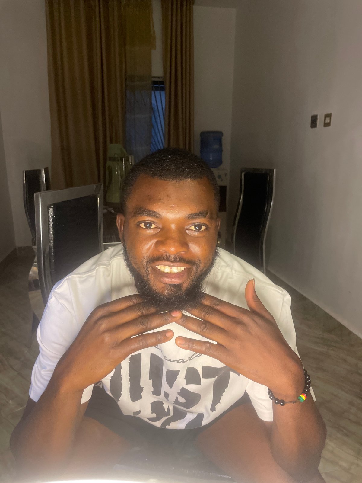 Man poses for ring light video session in Jos
