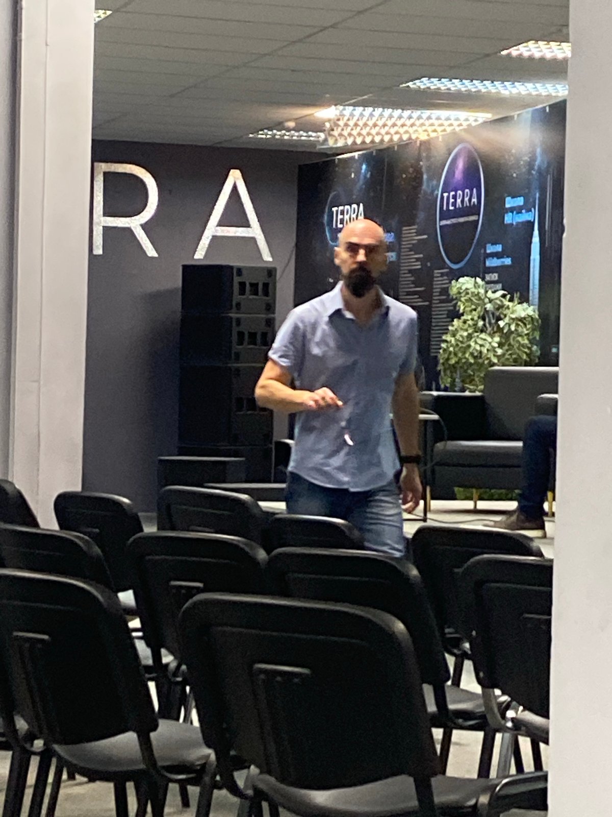 Activity inside an event venue during a quiet morning moment