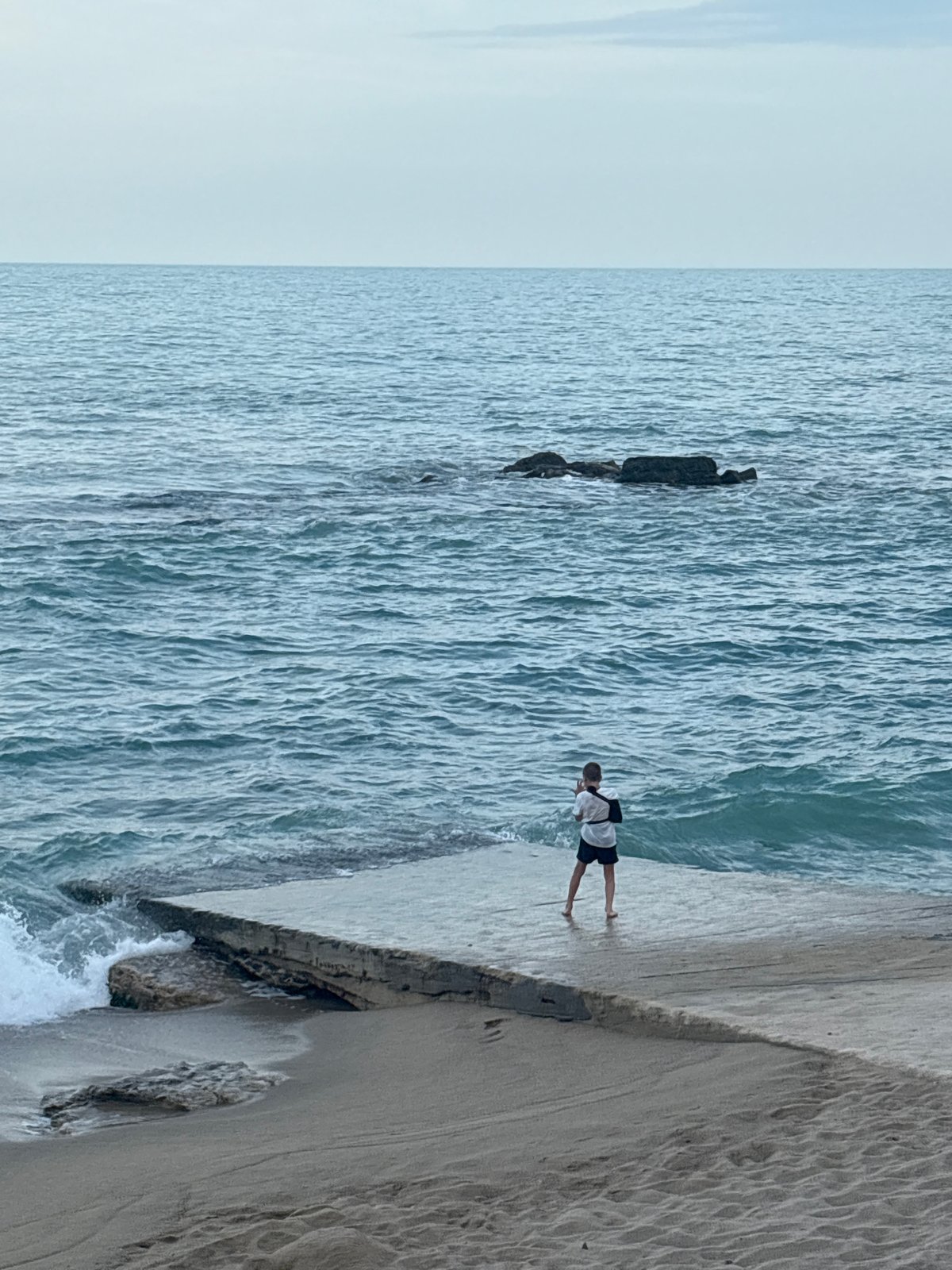 Coastal resort documented from multiple viewpoints during afternoon hours