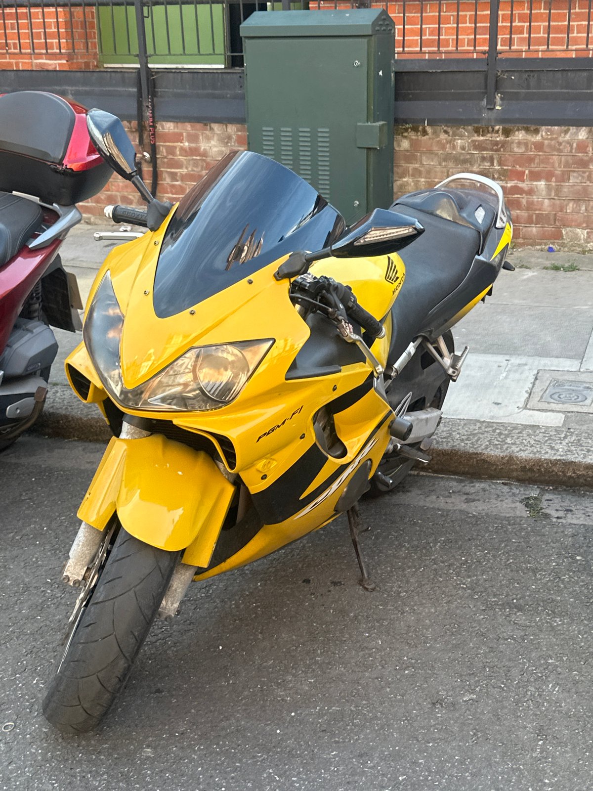 London street scenes documented: motorcycle, terraced houses, bulletin board