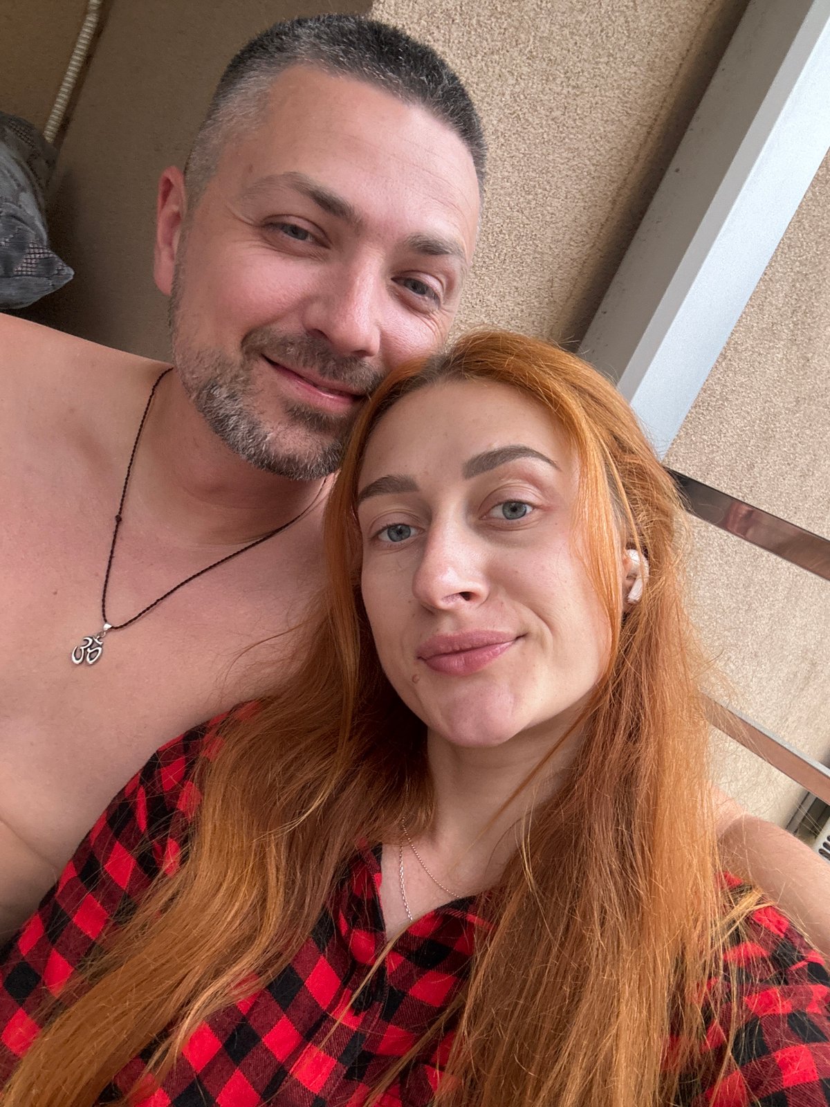 Woman enjoys snacks and selfies on Montenegro balcony
