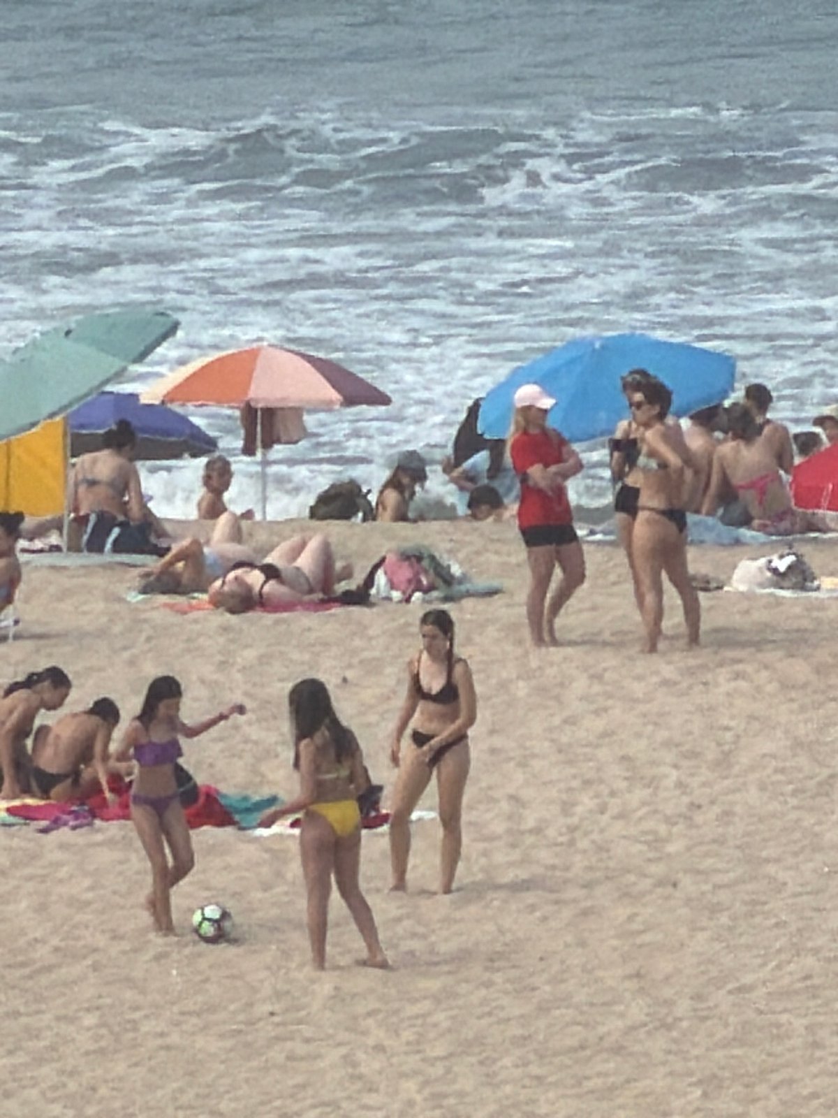 Crowded beach day captured at Espinho, Portugal coastline