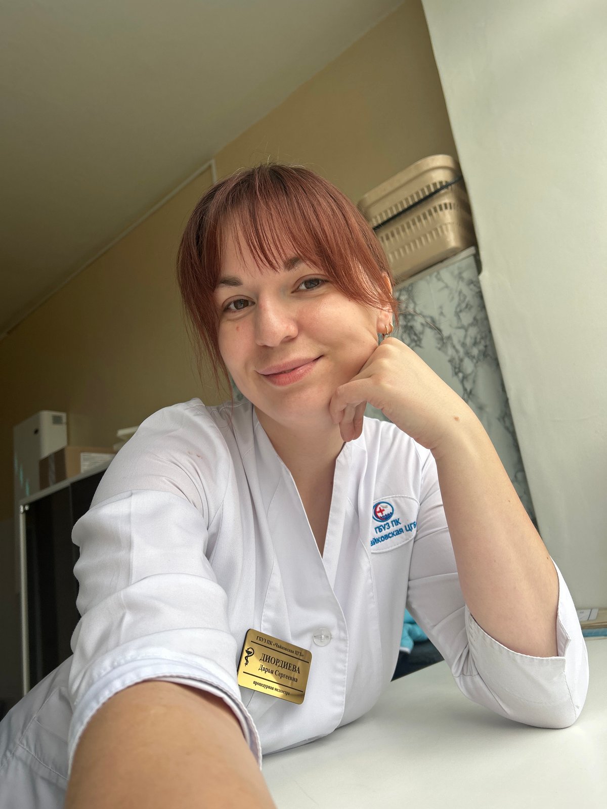 Lab-coated woman and vehicle interior observed in Foki, Russia