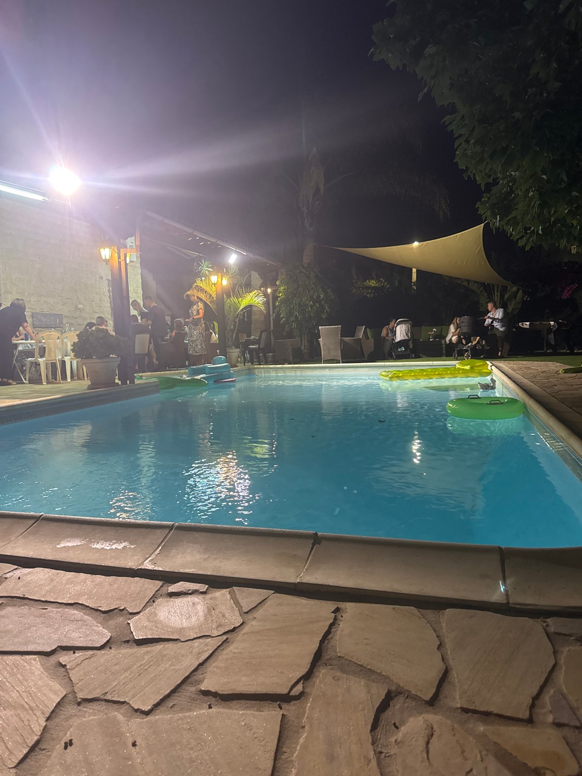 Nighttime pool scene glowing under lights in Pervolia, Cyprus