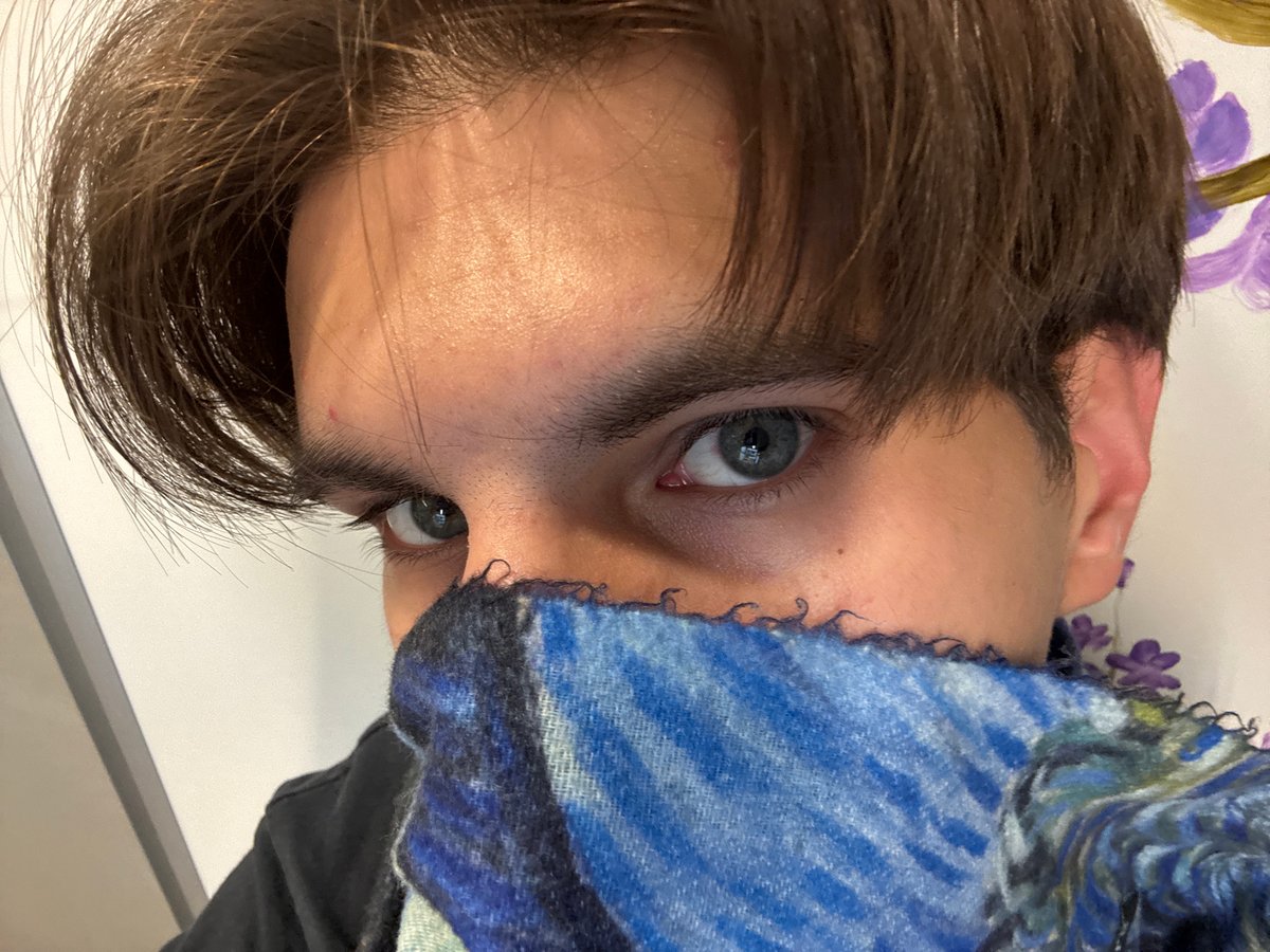 Close-up portrait captured in Sofia showing person with blue scarf