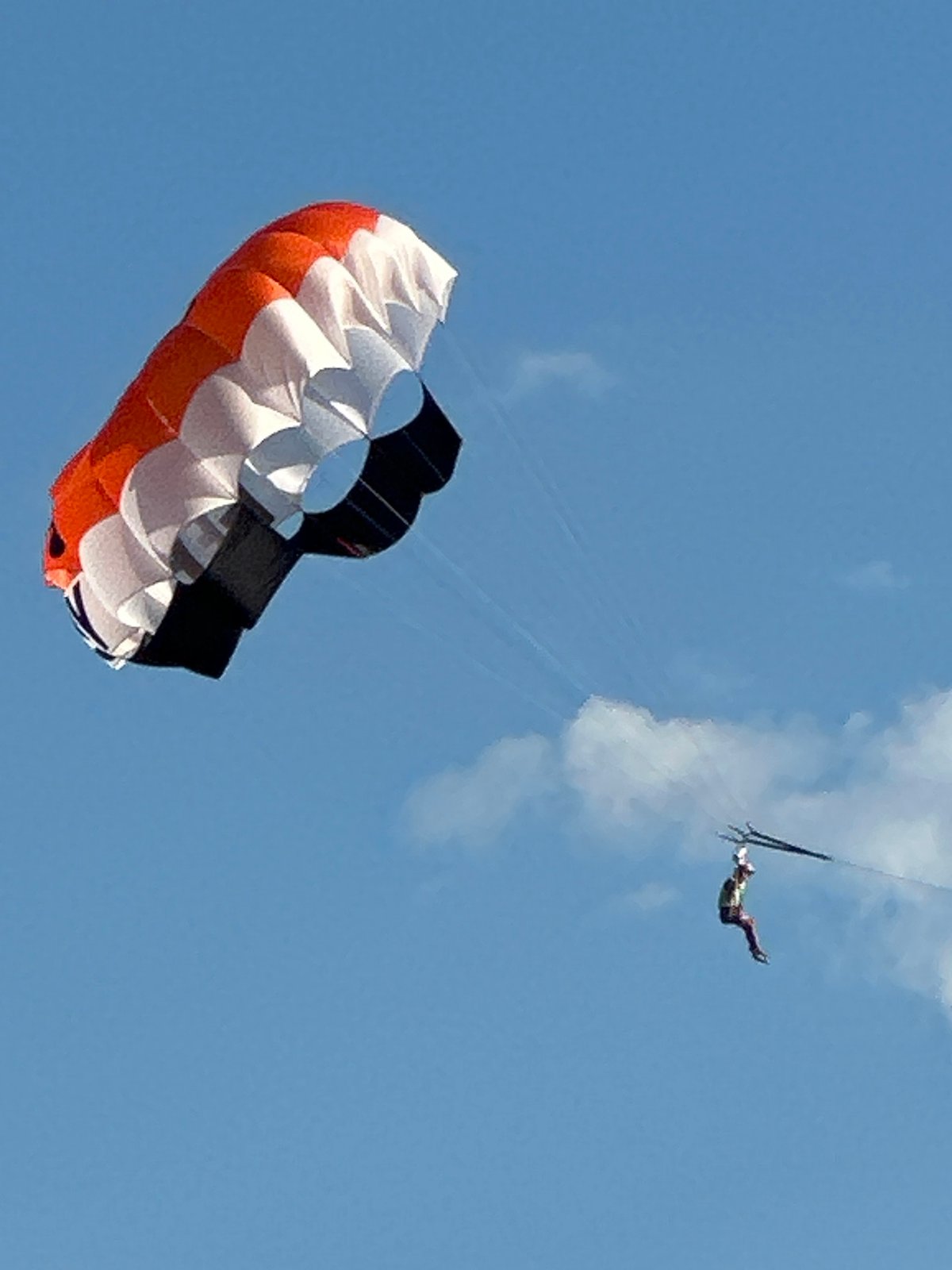 Beach day in Boreti with parasails flying overhead