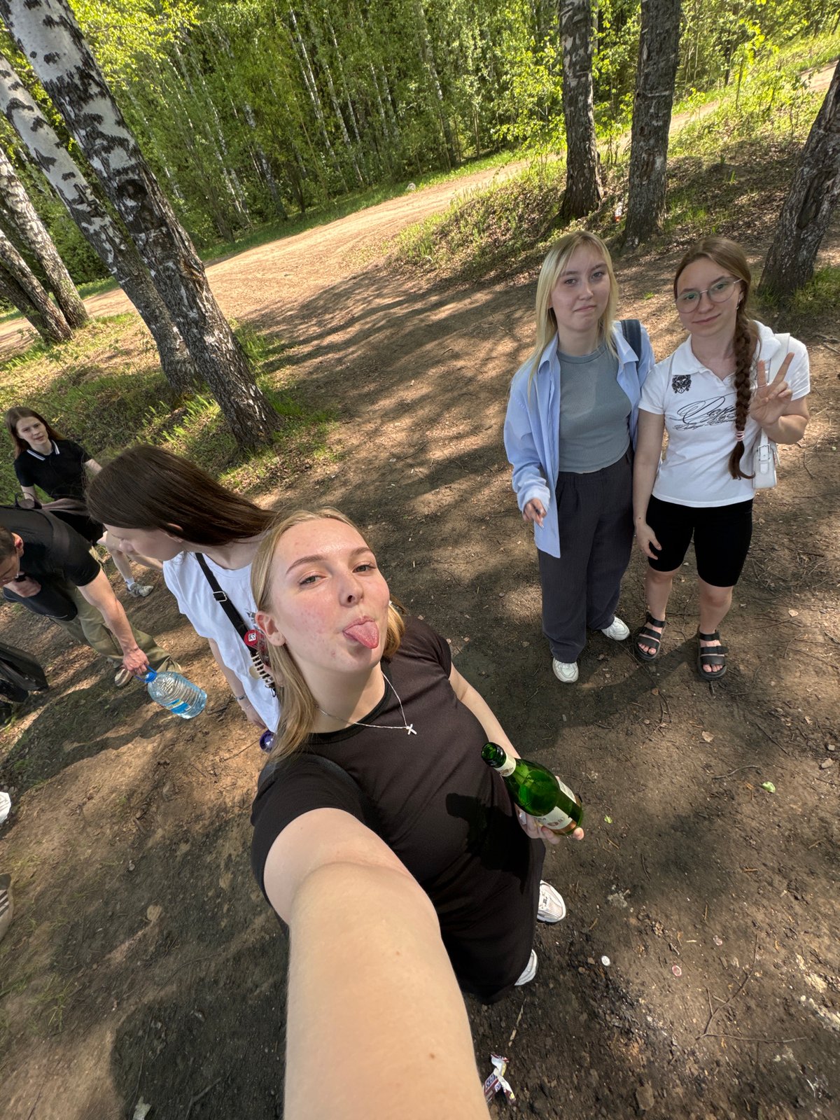 Young women enjoy morning picnic by Perm riverbank