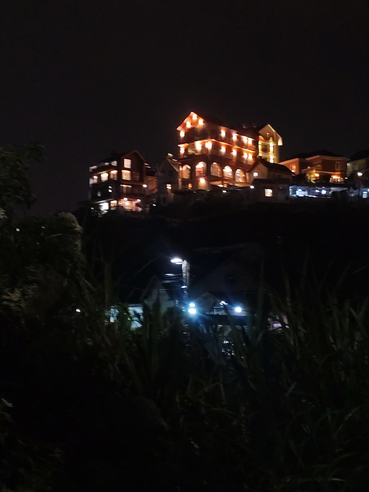 Nighttime Da Lat hillside buildings documented by witness