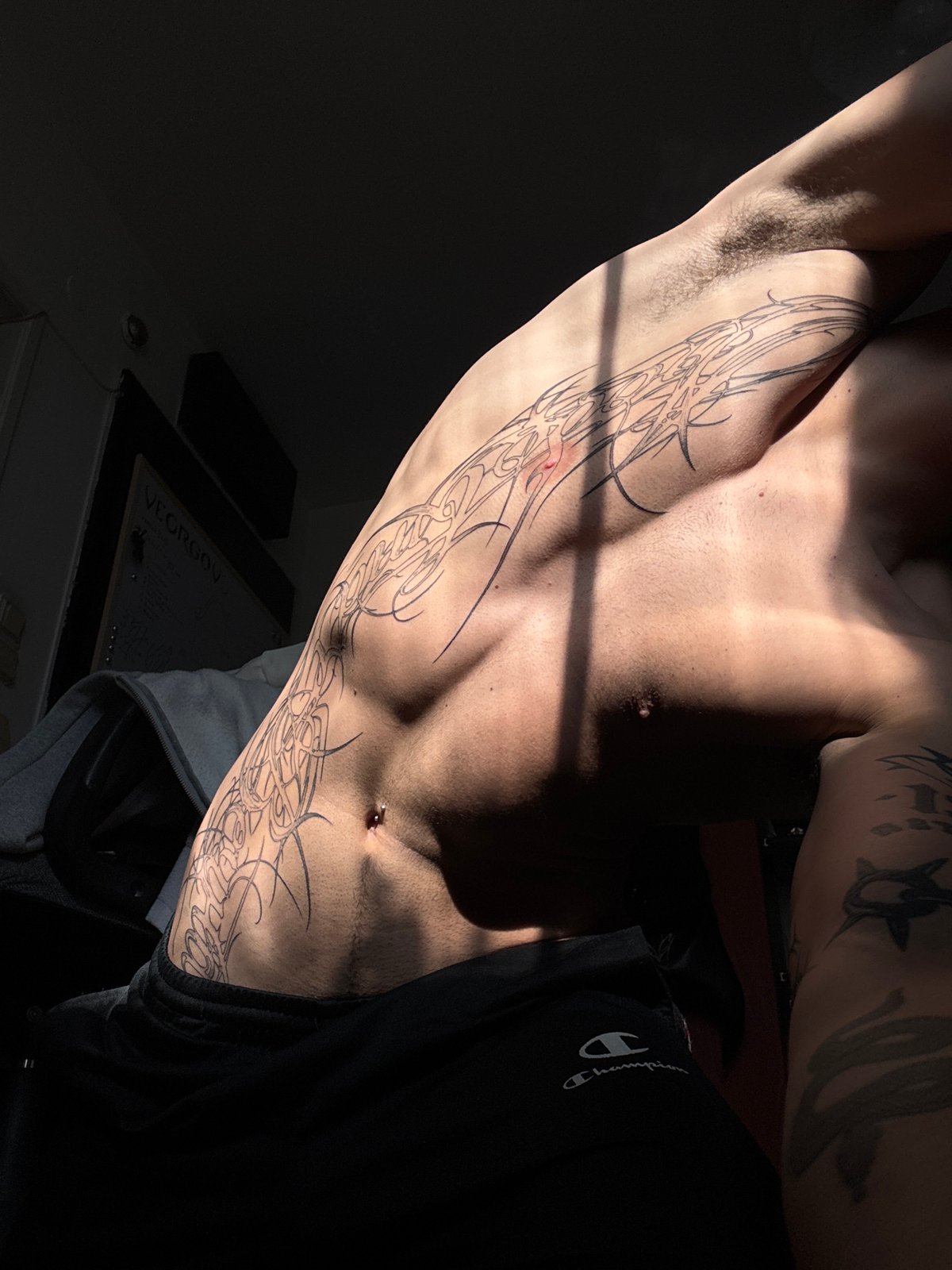 Heavily tattooed person photographed multiple times in Sofia
