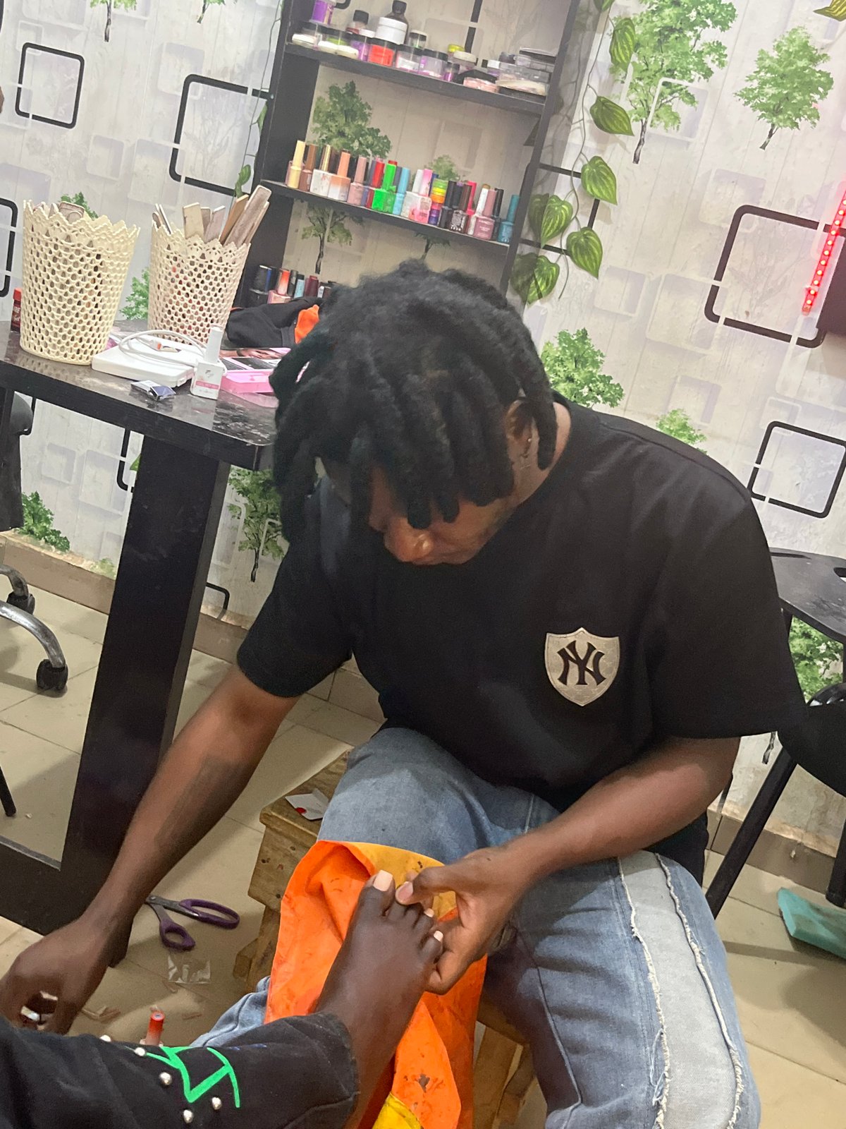 Daily life moments documented across Jos, Nigeria marketplace and salons