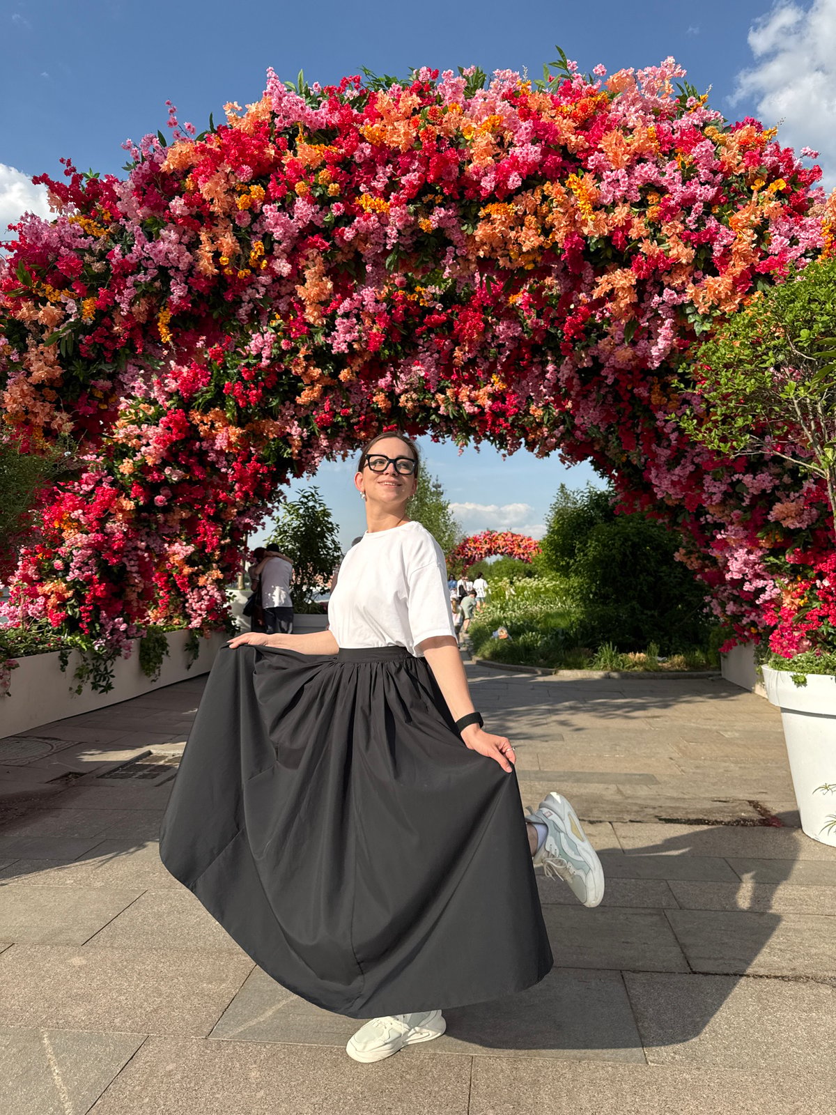 Woman poses for photos at Moscow landmarks and gardens