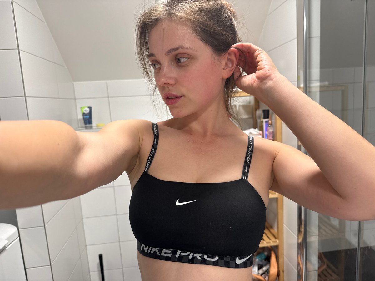 Woman takes bathroom mirror selfies in Vrchlabí