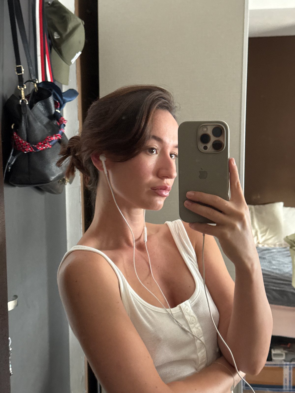 Mirror selfies in a Tel Aviv bedroom, summer outfit ready to go