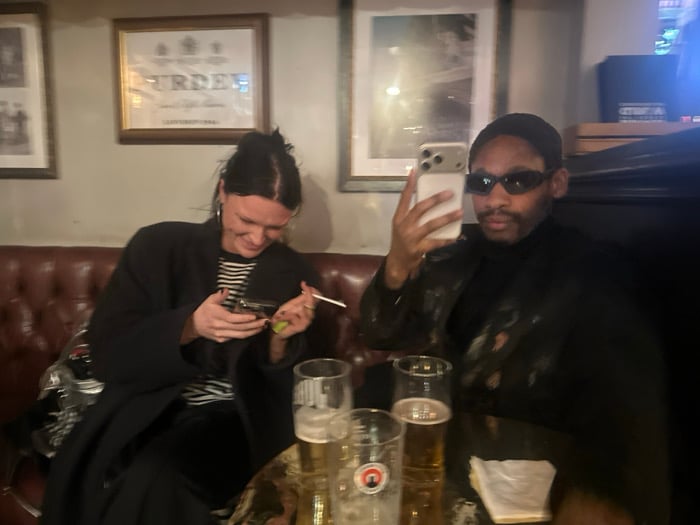 Young adults socialize at London pub Sunday evening