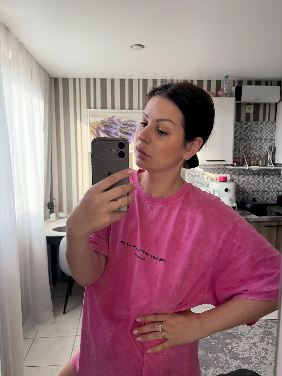 Morning at home in Sochi, pink t-shirt and coffee in hand