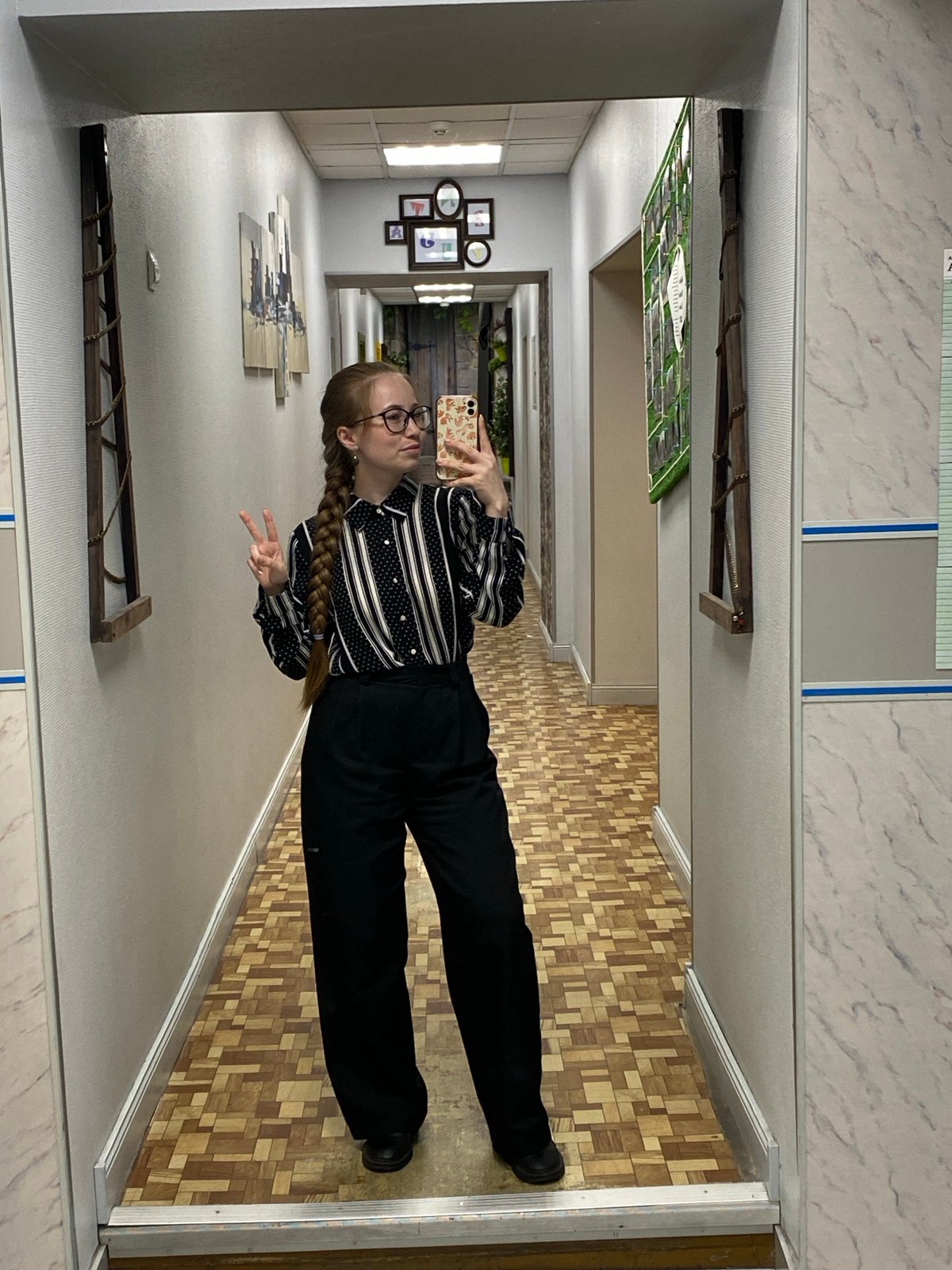 Student with schedule walks through Saint Petersburg school hallway