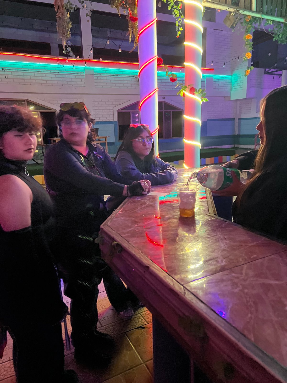 Late-night DJ event at a lit-up Arica venue