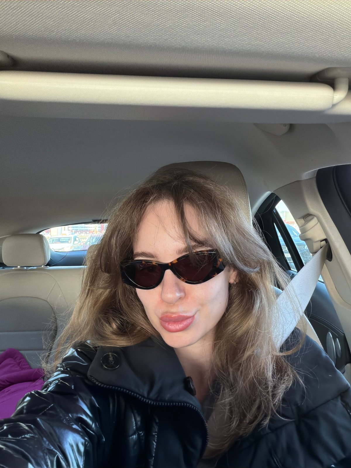 Woman Takes Selfie in Car in Kommunarka, Russia