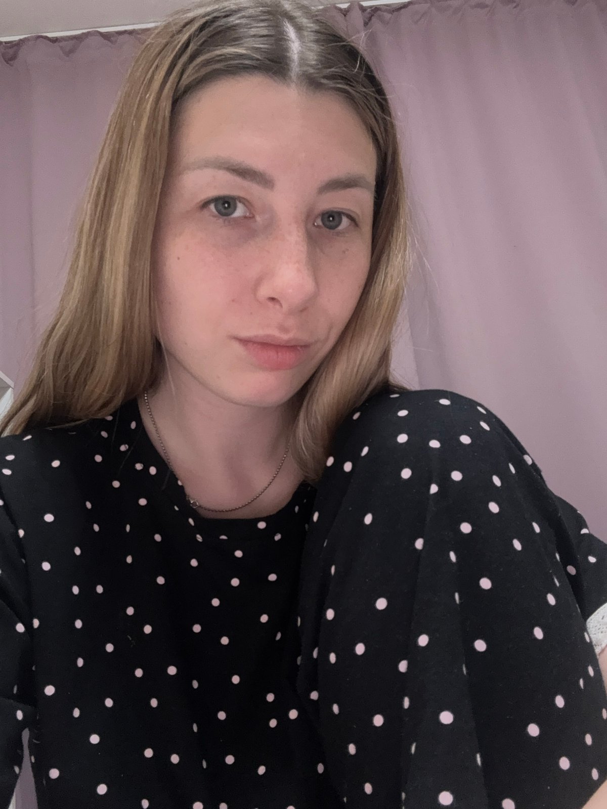 Woman takes selfies in polka-dot outfit in Moscow