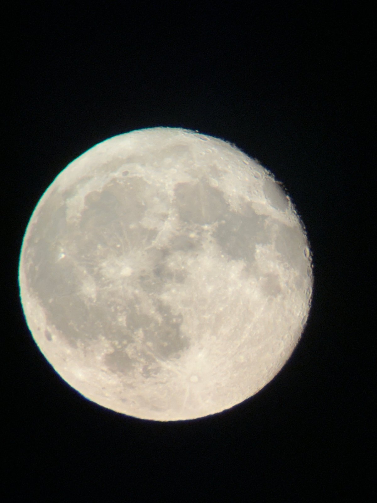 Moon photographed two ways over Târgu Neamț on a summer evening