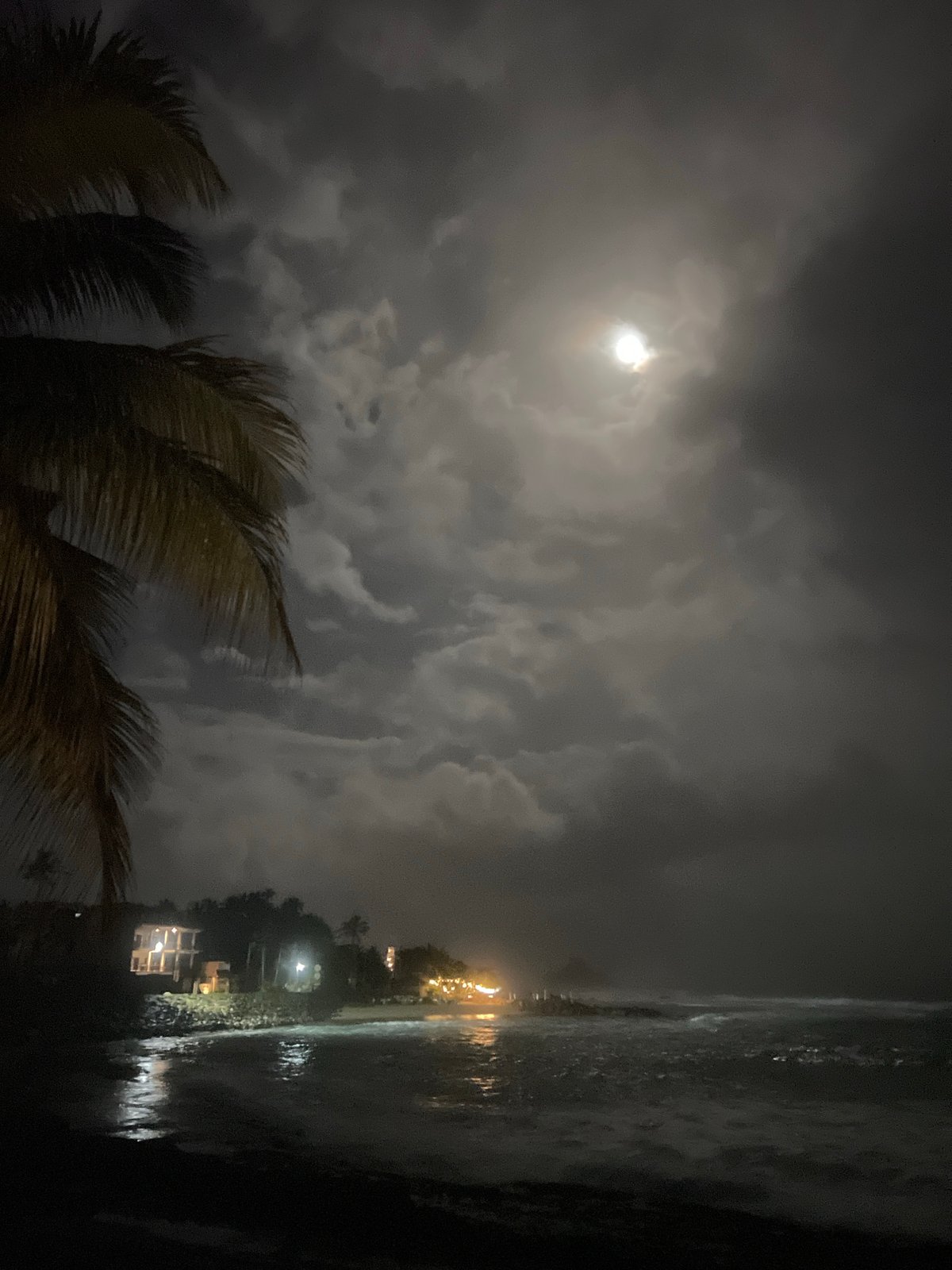 Full moon illuminates cloudy coastal night in Goviyapana, Sri Lanka