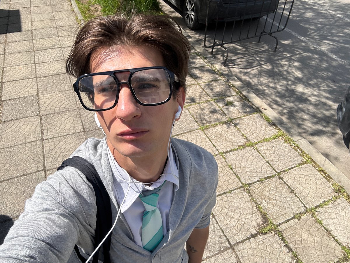 Person photographed from multiple angles in Sofia street session