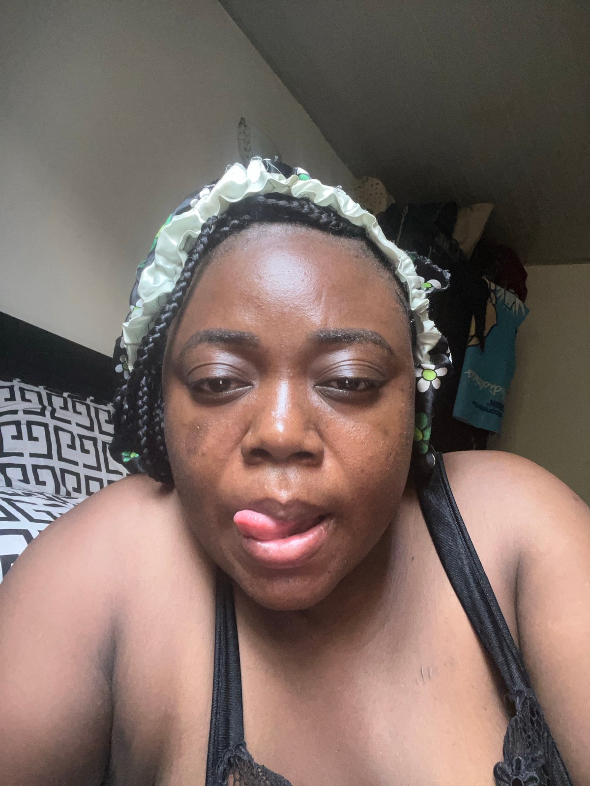 Person takes relaxed selfies in bedroom in Abuja