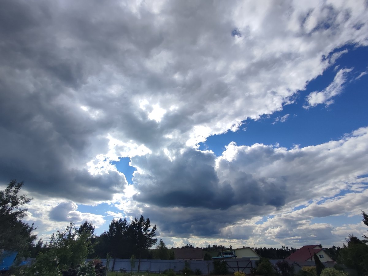 Outdoor portrait session amid storm clouds in Fokino, Russia
