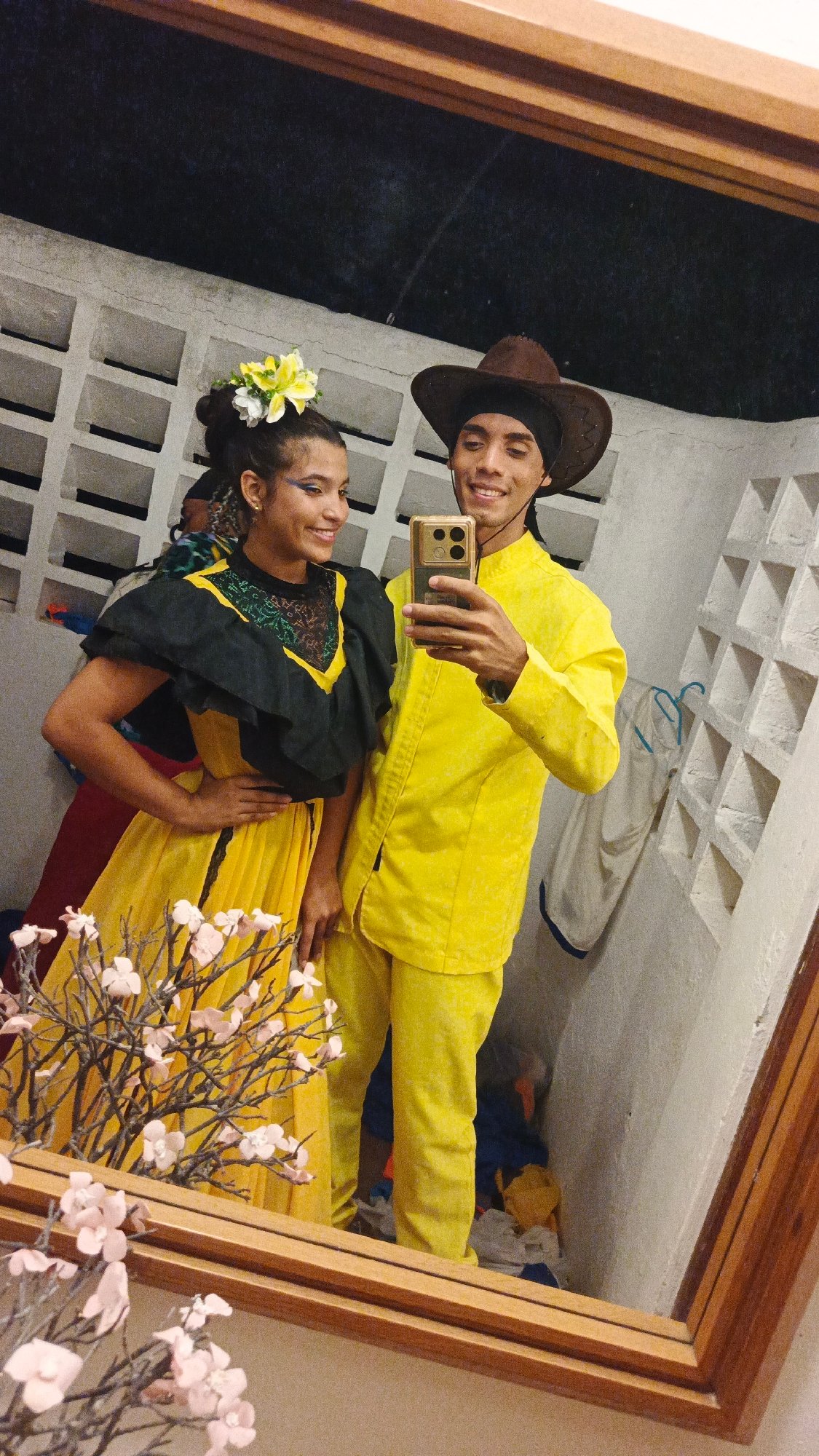 Two people take selfie in traditional dress, Venezuela