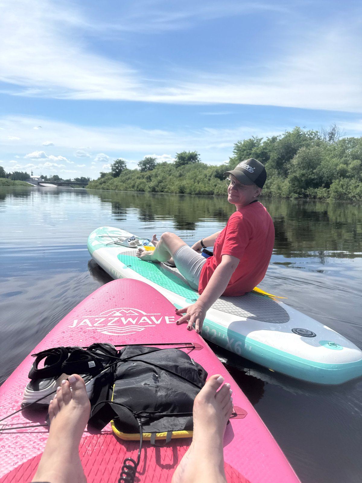 Two paddleboarders enjoy calm morning on Vologda River