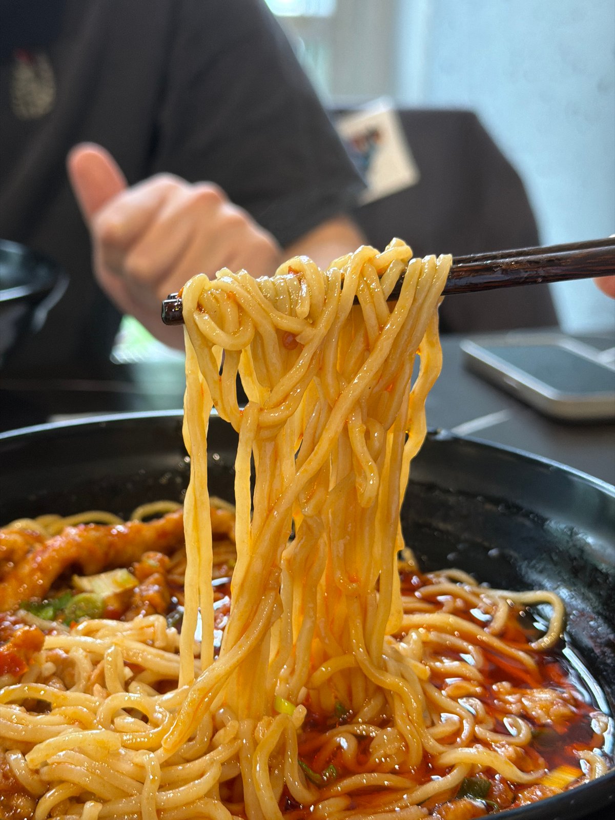 Diner documents Asian restaurant meal in Saint Petersburg