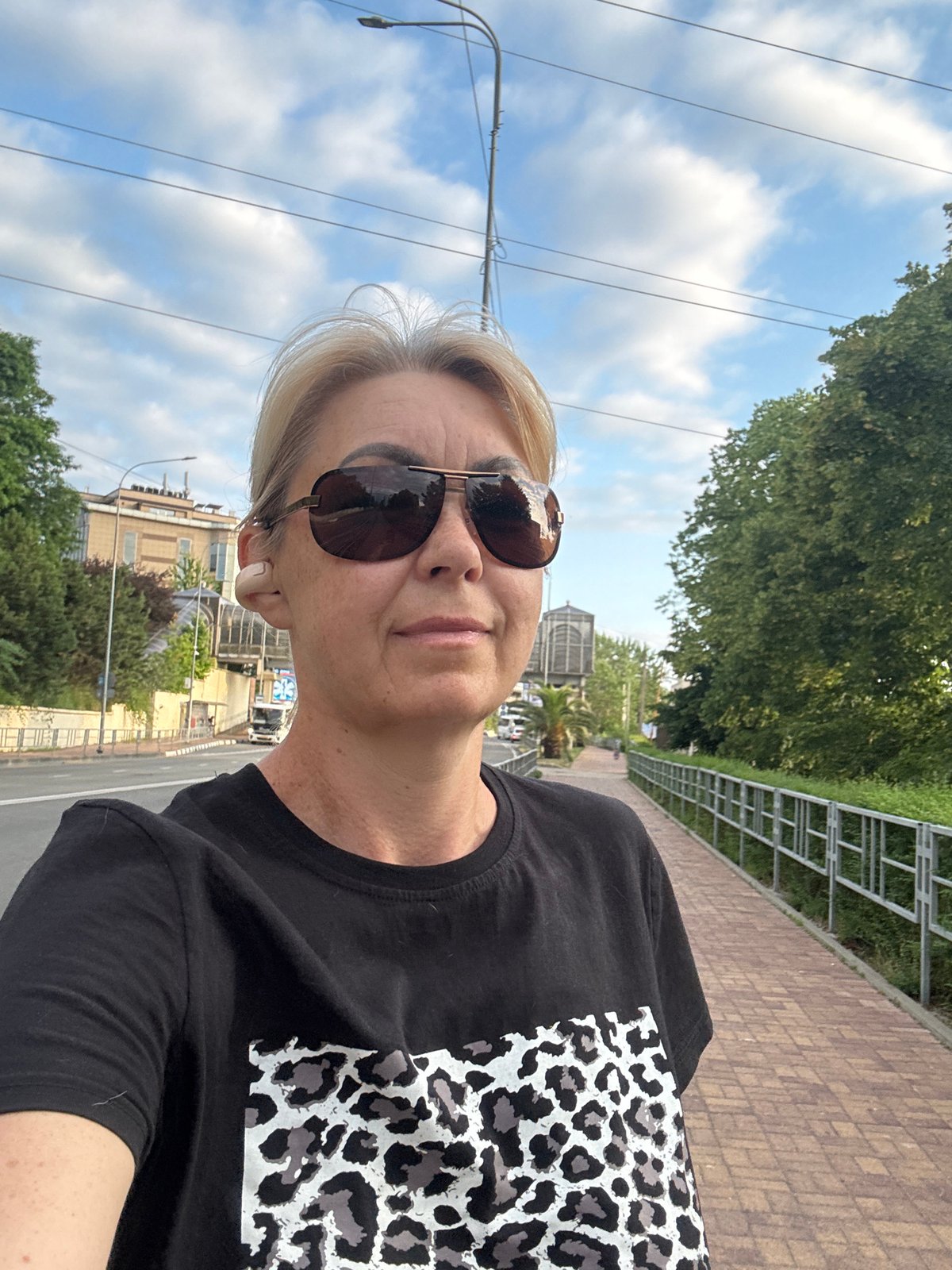 Afternoon stroll along a Sochi walkway with palms and magnolias