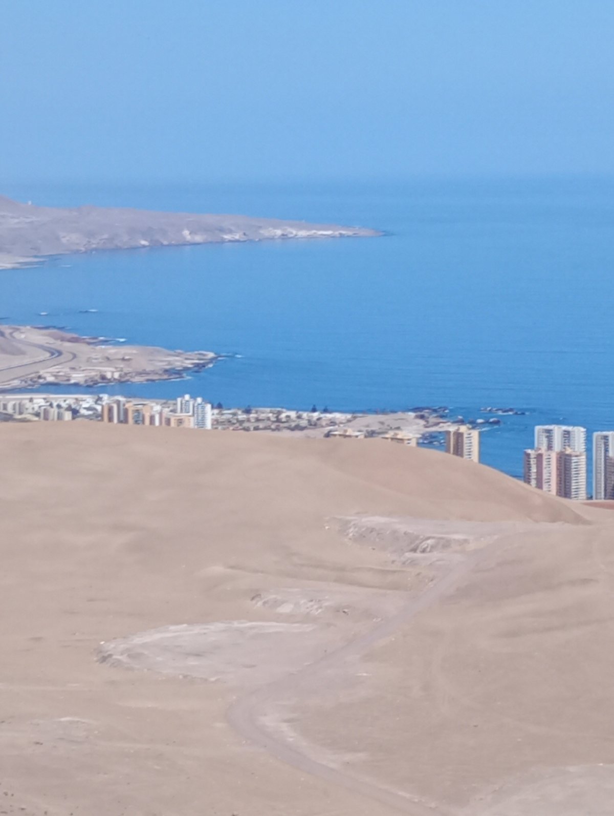 Aerial views capture Iquique's urban-desert contrast from high vantage