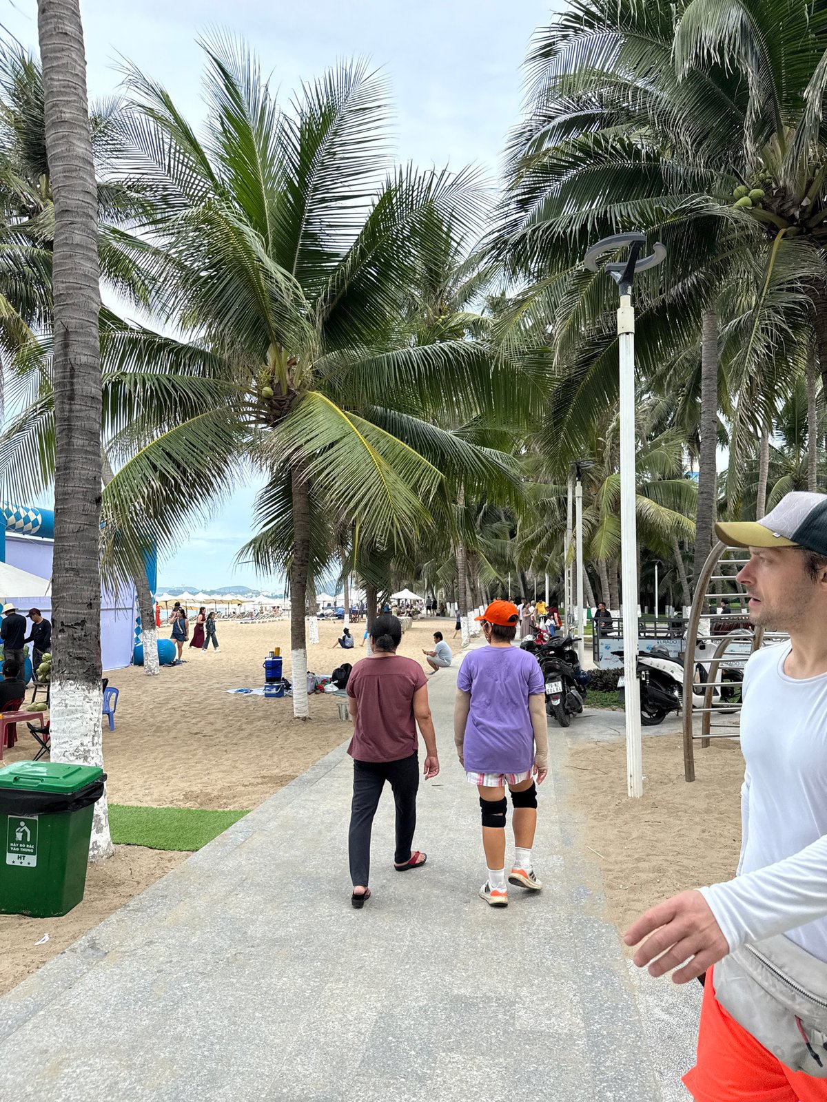 Crowded Nha Trang beach on a cloudy summer morning
