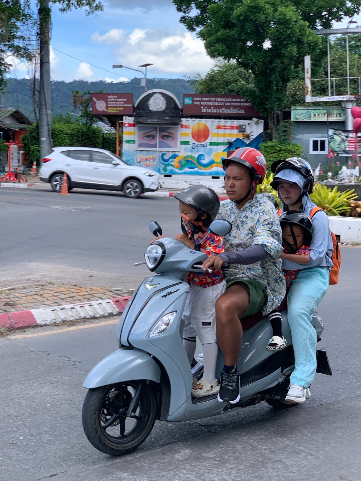 Sunday morning scooter traffic through Ban Bang Rak, Koh Samui