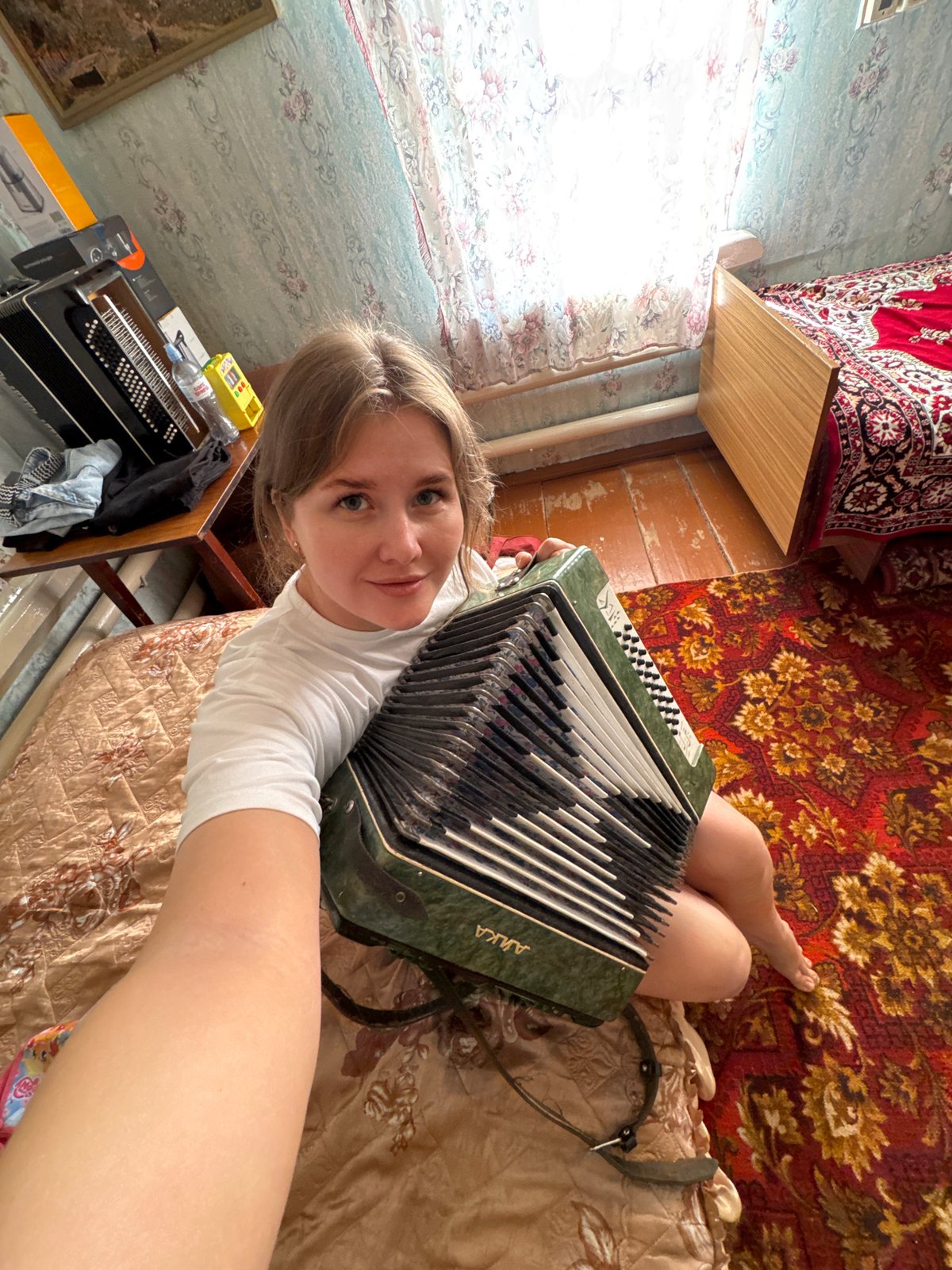 Woman with accordion, decorative gnome spotted in Foki home