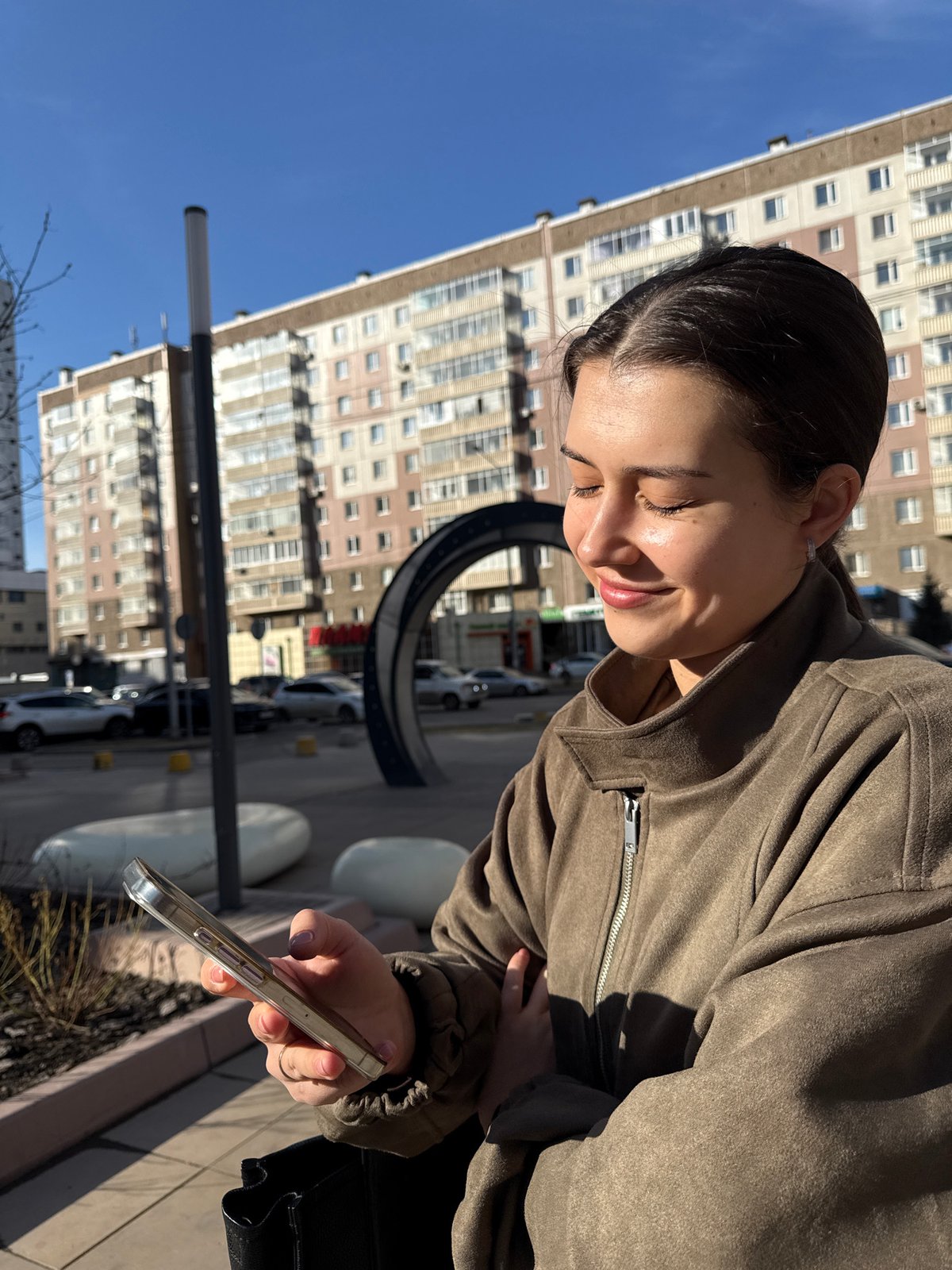 Woman photographed in urban Krasnoyarsk setting