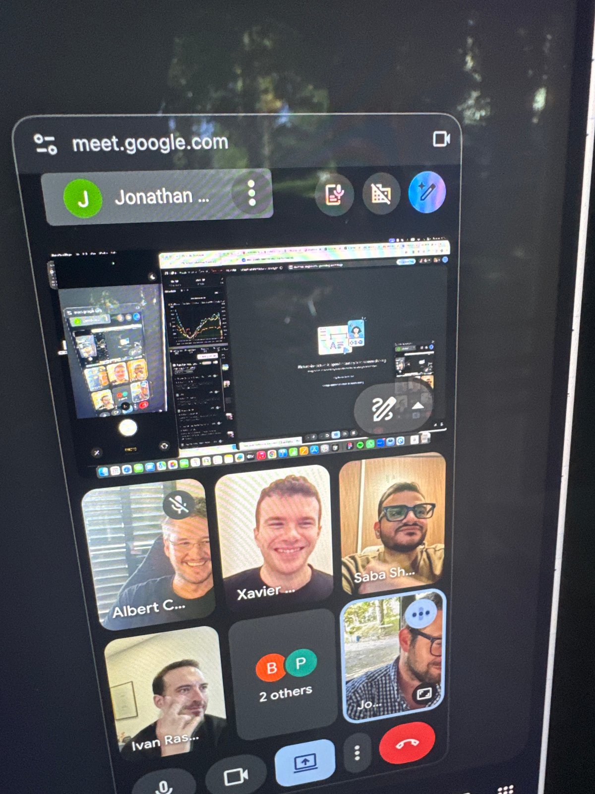 Video conference observed on mobile device in Erba, Italy
