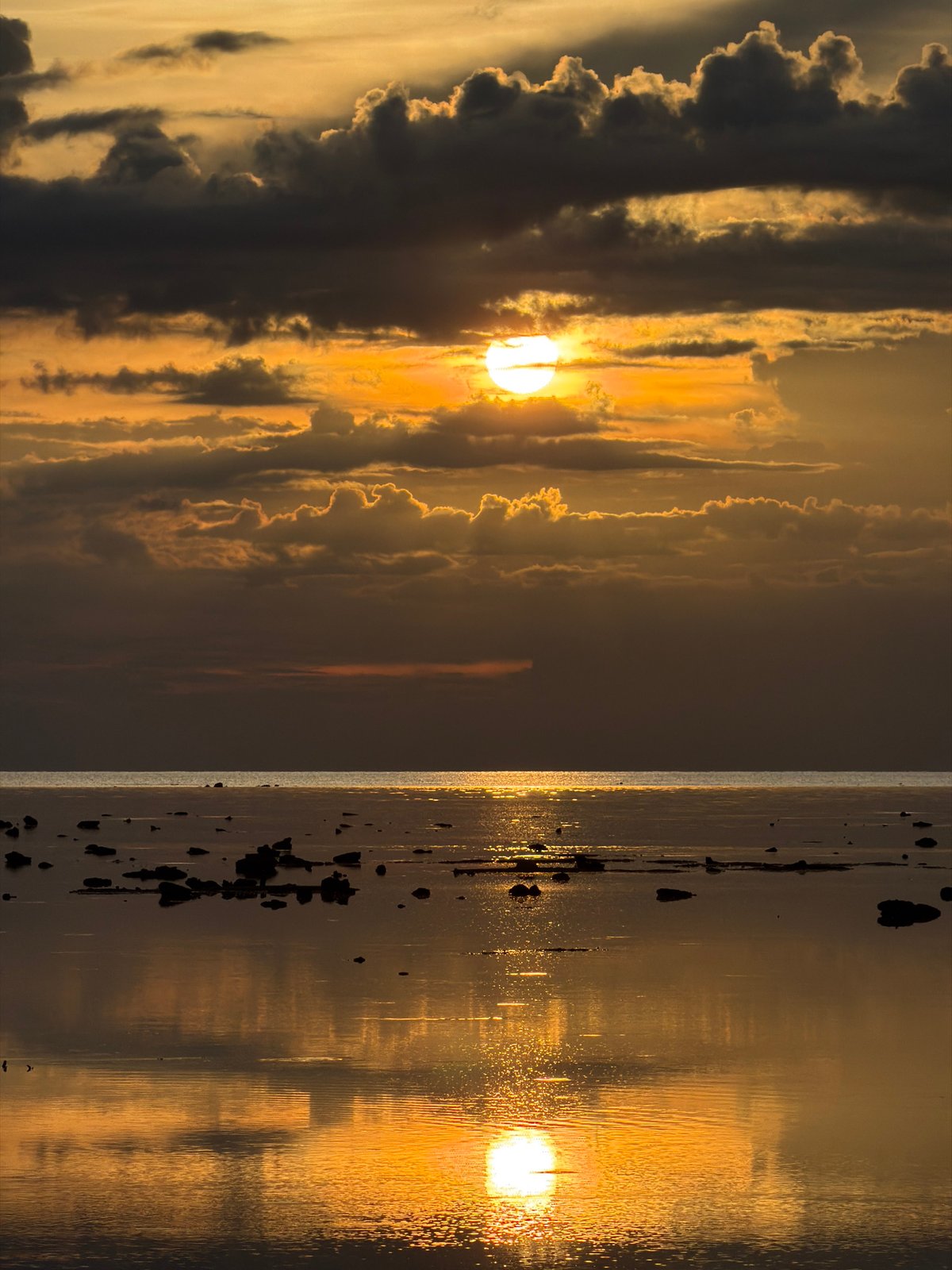 Stormy sunset on the Baan Plai Laem coast, with nearby homes