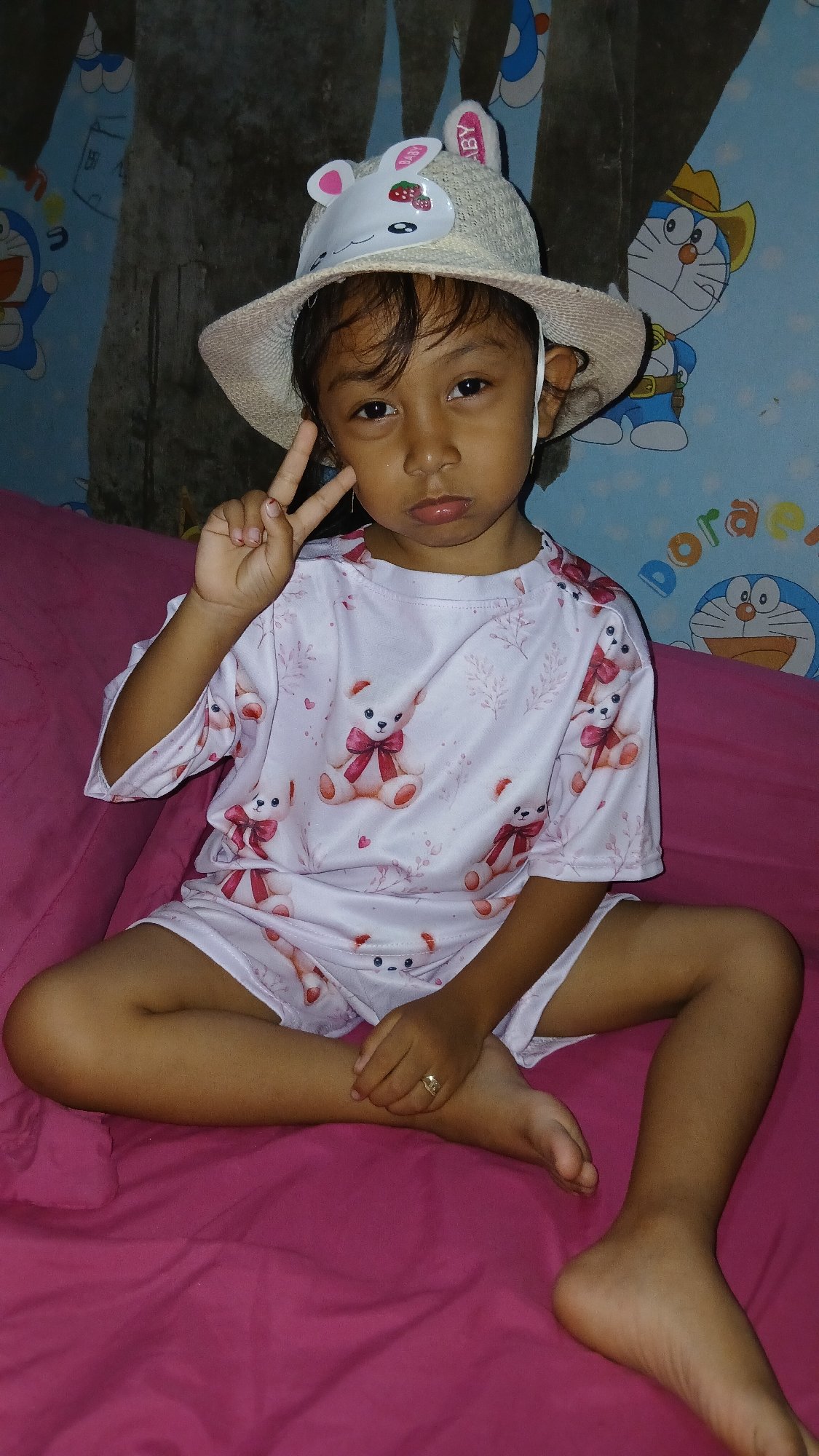 Afternoon at home: teddy bear pajamas, Doraemon walls, and coffee