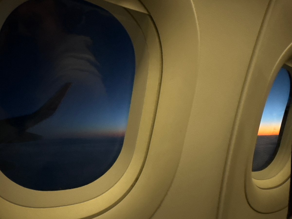 Passenger captures dual airplane window views over Balkans