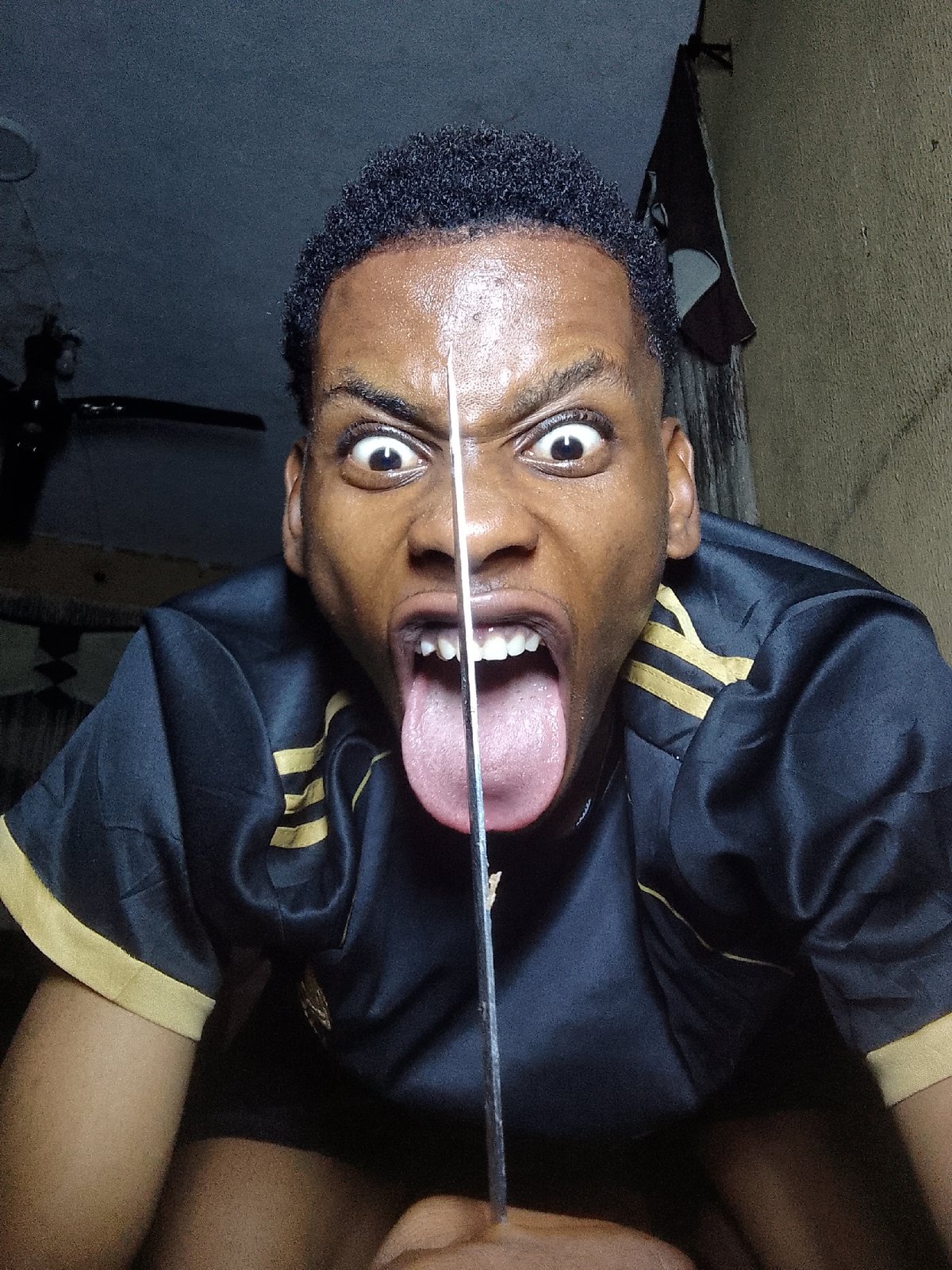 Person captured making dramatic expressions with knives and bananas