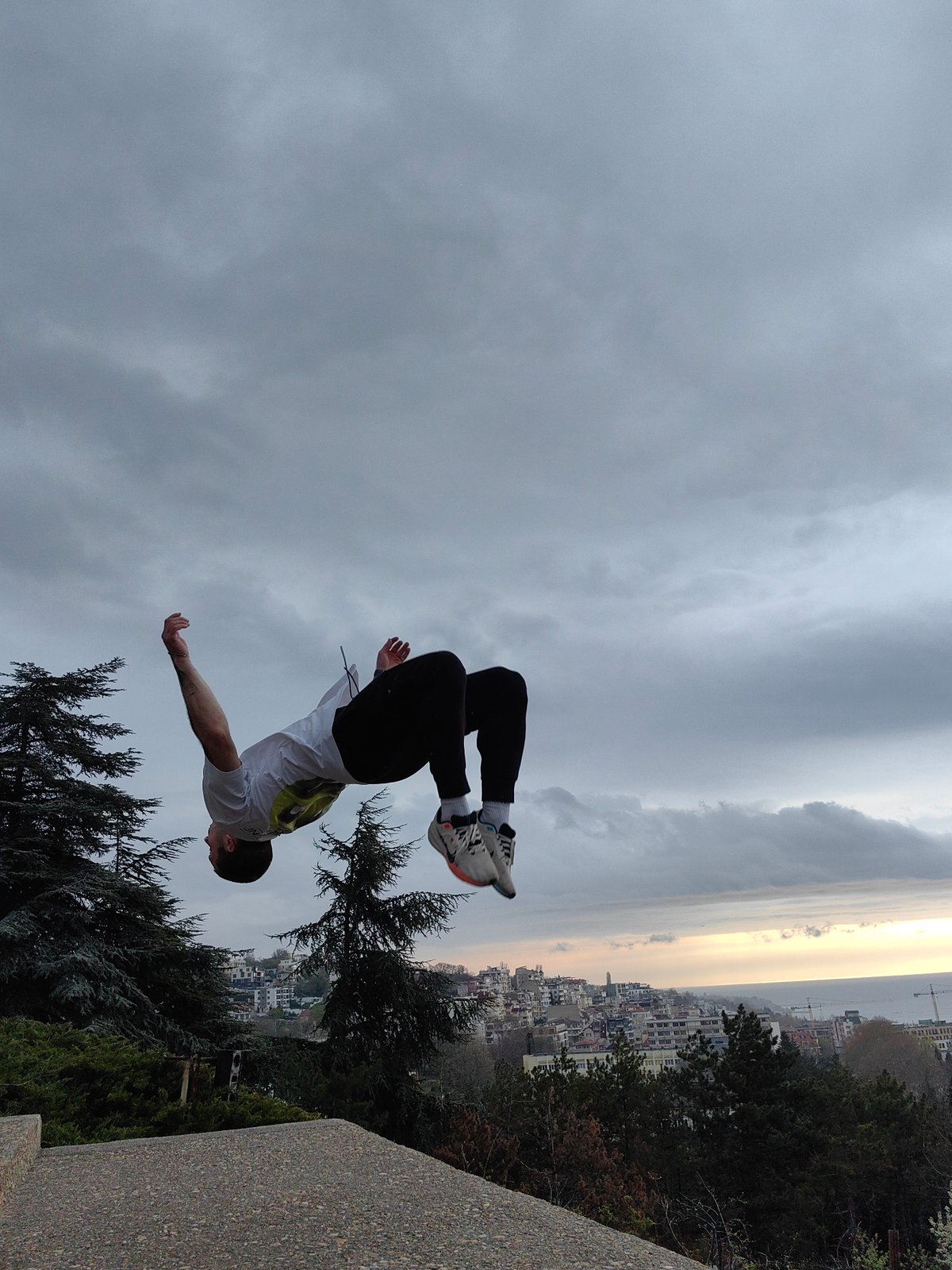 Man performs morning backflips on concrete structure in Varna